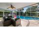 Screened patio with seating overlooking the pool at 416 Giovanni Dr, Nokomis, FL 34275