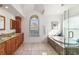 Bathroom with granite countertop double vanity at 4901 Fallcrest Cir, Sarasota, FL 34233