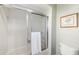 Simple bathroom with shower and white tile at 4901 Fallcrest Cir, Sarasota, FL 34233