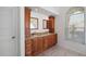 Double vanity bathroom with granite countertop at 4901 Fallcrest Cir, Sarasota, FL 34233