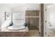 Spa-like bathroom with soaking tub and shower at 4901 Fallcrest Cir, Sarasota, FL 34233