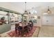 Formal dining room with a chandelier and built-in cabinetry at 4901 Fallcrest Cir, Sarasota, FL 34233