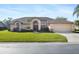 Single-story house with a two-car garage and well-maintained lawn at 4901 Fallcrest Cir, Sarasota, FL 34233