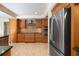 Modern kitchen with stainless steel appliances and wood cabinets at 4901 Fallcrest Cir, Sarasota, FL 34233