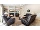 Comfortable living room with a fireplace and leather seating at 4901 Fallcrest Cir, Sarasota, FL 34233