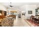 Spacious living room with tiled floor and access to the pool area at 4901 Fallcrest Cir, Sarasota, FL 34233