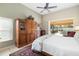 Main bedroom with wood cabinet and pool access at 4901 Fallcrest Cir, Sarasota, FL 34233