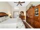 Main bedroom with walk-in closet and wood furniture at 4901 Fallcrest Cir, Sarasota, FL 34233