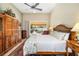 Main bedroom with wood furniture and pool view at 4901 Fallcrest Cir, Sarasota, FL 34233