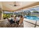 Relaxing pool area with covered patio, spa, and outdoor dining at 4901 Fallcrest Cir, Sarasota, FL 34233