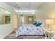 Cozy bedroom with floral bedding and a light color scheme at 500 N Jefferson Ave # C3, Sarasota, FL 34237