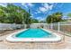 Inviting community pool with lounge chairs and brick patio at 500 N Jefferson Ave # C3, Sarasota, FL 34237