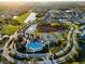 Aerial view of the community clubhouse, pool, playground, tennis, and basketball courts at 5001 65Th E Ter, Ellenton, FL 34222