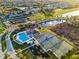 Aerial view of community amenities including a clubhouse, pool, playground, tennis courts, and basketball courts at 5001 65Th E Ter, Ellenton, FL 34222