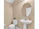 Well-lit powder room features a modern sink and vanity, complemented by neutral decor at 5001 65Th E Ter, Ellenton, FL 34222