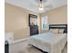 Cozy bedroom with a ceiling fan, carpeted floor, and a beautiful dark wood dresser at 5001 65Th E Ter, Ellenton, FL 34222