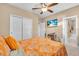 Bright bedroom with a bed, ceiling fan and view to the bathroom at 5001 65Th E Ter, Ellenton, FL 34222