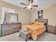 Cozy bedroom with a soft bed, ceiling fan and neutral decor at 5001 65Th E Ter, Ellenton, FL 34222