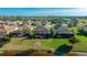 Overhead shot of a home featuring a screened-in pool area, set against a backdrop of serene water at 508 Wildlife Gln, Bradenton, FL 34209