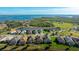 Gorgeous aerial view of a neighborhood with waterfront access and lush greenery at 508 Wildlife Gln, Bradenton, FL 34209