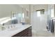 Clean bathroom features a tub with shower, vanity with sink and mirror, and bright lighting at 508 Wildlife Gln, Bradenton, FL 34209