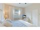 Bright bedroom with comfortable bed, window and shutter and a television at 508 Wildlife Gln, Bradenton, FL 34209