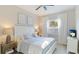 Comfortable bedroom featuring neutral decor, a plush bed, and a window with plantation shutters for natural light at 508 Wildlife Gln, Bradenton, FL 34209