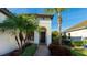 Charming front entrance with a well-manicured landscape and a tiled roof at 508 Wildlife Gln, Bradenton, FL 34209