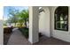 Beautiful front entrance with landscaped walkway, tropical plants, and decorative archway at 508 Wildlife Gln, Bradenton, FL 34209