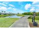 Landscaped walkway by the pond on the golf course at 5150 Mahogany Run Ave, Sarasota, FL 34241