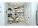 Kitchen features white cabinetry, breakfast nook, and built-in shelving at 5150 Mahogany Run Ave, Sarasota, FL 34241