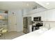 Updated kitchen features stainless steel appliances and white cabinetry at 5150 Mahogany Run Ave, Sarasota, FL 34241