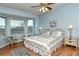 Spacious main bedroom with a king-size bed and large windows at 5150 Mahogany Run Ave, Sarasota, FL 34241