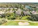 Aerial view of houses surrounded by golf course and water features at 5304 96Th E St, Bradenton, FL 34211