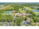 Aerial view of community amenities including a pool, golf course, tennis courts and clubhouse at 5304 96Th E St, Bradenton, FL 34211