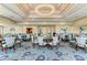 Spacious dining room featuring elegant tables, chairs, and a dazzling chandelier at 5304 96Th E St, Bradenton, FL 34211