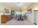 Traditional dining room with an area rug, chandelier, and elegant furniture at 5304 96Th E St, Bradenton, FL 34211