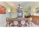 Dining area featuring a round table, classic chairs, and elegant lighting, creating a welcoming space for meals at 5304 96Th E St, Bradenton, FL 34211