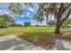 Picturesque golf course view with mature trees, expansive green, and partly cloudy skies at 5304 96Th E St, Bradenton, FL 34211