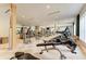 Modern gym with state-of-the-art equipment, wood accents, neutral colors, and large windows at 5304 96Th E St, Bradenton, FL 34211