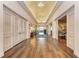 Community lobby with wood floors, decorative columns, and a view into the dining area at 5304 96Th E St, Bradenton, FL 34211