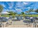 Outdoor dining area with umbrellas, elegant seating and a serene atmosphere at 5304 96Th E St, Bradenton, FL 34211