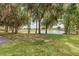 Scenic pond view surrounded by lush trees and greenery in a serene setting at 5304 96Th E St, Bradenton, FL 34211