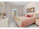 Light and bright bedroom with a queen-size bed and plenty of natural light at 5361 Salcano St, Sarasota, FL 34238