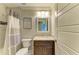 Bathroom featuring granite countertops and tile in the shower at 5551 Allamanda Ave, North Port, FL 34288