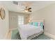 Bedroom featuring a queen bed, ceiling fan, and neutral walls at 5551 Allamanda Ave, North Port, FL 34288