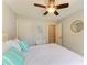 Bedroom with a queen bed, ceiling fan, and an ensuite bathroom at 5551 Allamanda Ave, North Port, FL 34288