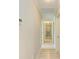 Hallway with crown molding and artwork on the wall at 5551 Allamanda Ave, North Port, FL 34288