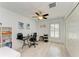 Bright office featuring modern desk, natural light, and ceiling fan at 5551 Allamanda Ave, North Port, FL 34288