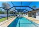 Enclosed in-ground pool with patio, perfect for year-round swimming and outdoor enjoyment at 5551 Allamanda Ave, North Port, FL 34288